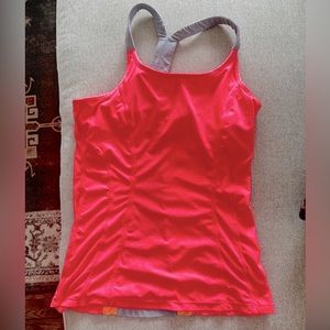 MPG bright coral yoga tank with gray racer back.
